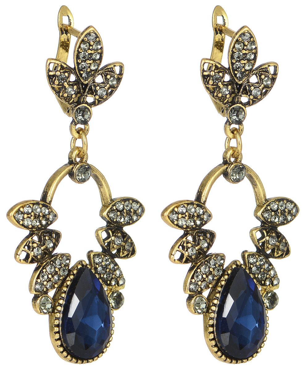 Серьги Taya, цвет: золотистый, темно-синий. T-B-11382T-B-11382-EARR-GL.D.BLUE Серьги Taya, цвет: золотистый, темно-синий. T-B-11382T-B-11382-EARR-GL.D.BLUEСтильные серьги современного дизайна Taya изготовлены из металлического сплава и выполнены в виде оригинальных подвесок, инкрустированных стразами. Подвеска представляет собой трилистник, крепящийся к мочке уха, далее расположена скоба с листиками и крупным каплевидным камнем. Модель не оставит равнодушной ни одну любительницу изысканных и необычных украшений. Серьги застегиваются на английский замок. Такие серьги позволят вам с легкостью воплотить самую смелую фантазию и создать собственный, неповторимый образ.
