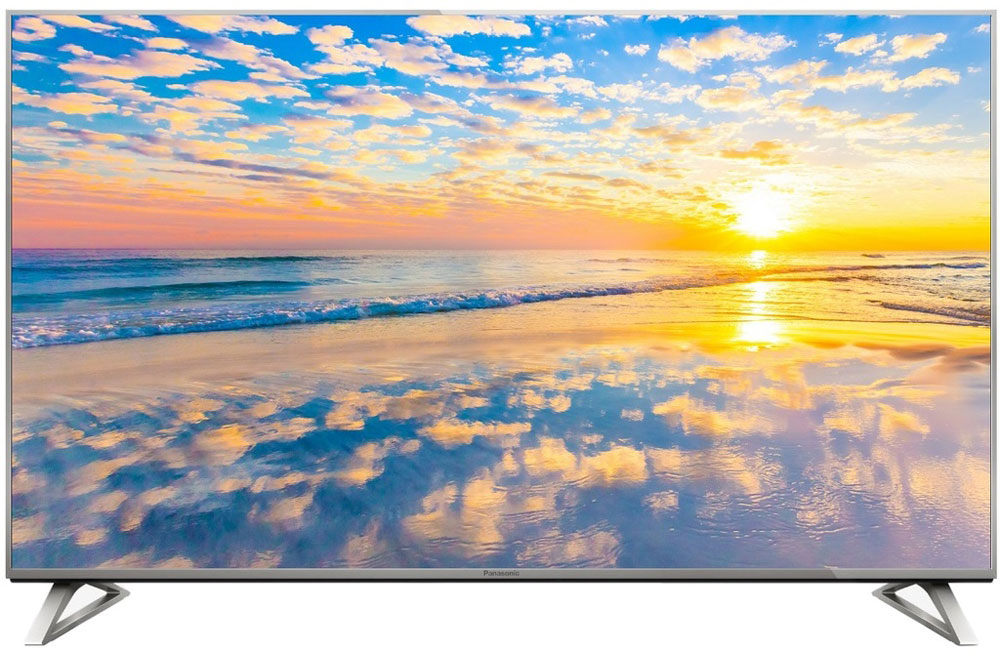 Panasonic TX-50DXR700 4K телевизорTX-50DXR700 Panasonic TX-50DXR700 4K телевизорTX-50DXR700Телевизор Panasonic TX-50DXR700 обладает красочной картинкой с разрешением 4K, смарт-функциями на базе ОС Firefox, а уникальная подставка позволяет вам выбрать один из двух стилей установки. Разрешение 3840 х 2160 на 4К Ultra HD-телевизорах обеспечивает настолько детализированное и чистое изображение, что вам покажется, будто вы смотрите в окно, а не в экран телевизора. Панели с высокой яркостью и широким цветовым охватом и мощный четырехъядерный процессор Quad Core Pro гарантируют, что от вашего взгляда не скроется ни одна деталь изображения в формате 4К. HDR-совместимый телевизор Panasonic TX-50DXR700 передает ту картину окружающего мира, которая наиболее соответствует реальности. Темные цвета более глубокие, а светлые еще ярче, чем на экране обычного телевизора, что обеспечивает уровень натуралистичности, недоступный для телевидения прежде. Телевизор Panasonic оснащен передовой технологией Wide Colour Phosphor, которая расширяет цветовой...