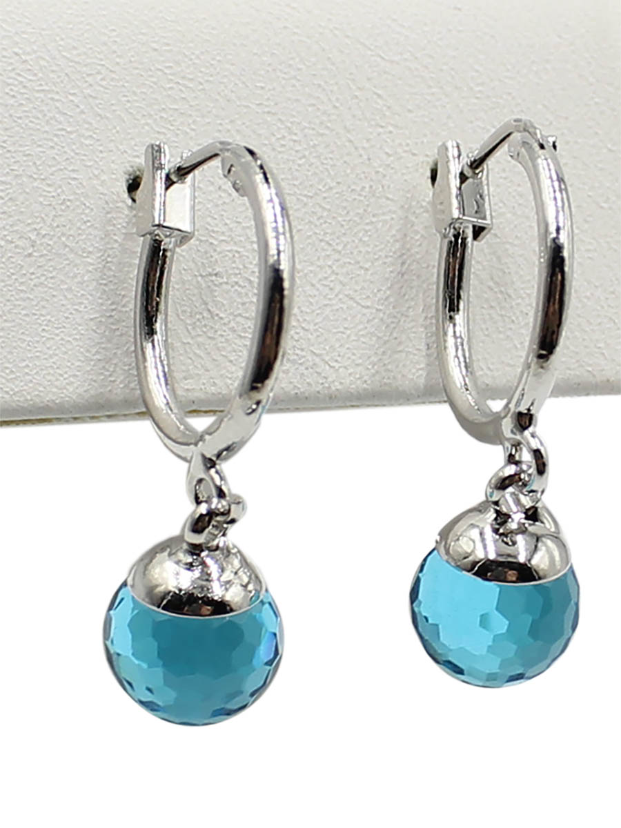Серьги Taya, цвет: серебристый, синий. T-B-12383T-B-12383-EARR-SL.BLUE Серьги Taya, цвет: серебристый, синий. T-B-12383T-B-12383-EARR-SL.BLUEСерьги с итальянской застежкой изготовлены из бижутерного сплава. Классические серьги- кольца с подвеской. Подвеска оформлена в виде сияющего кристалла.