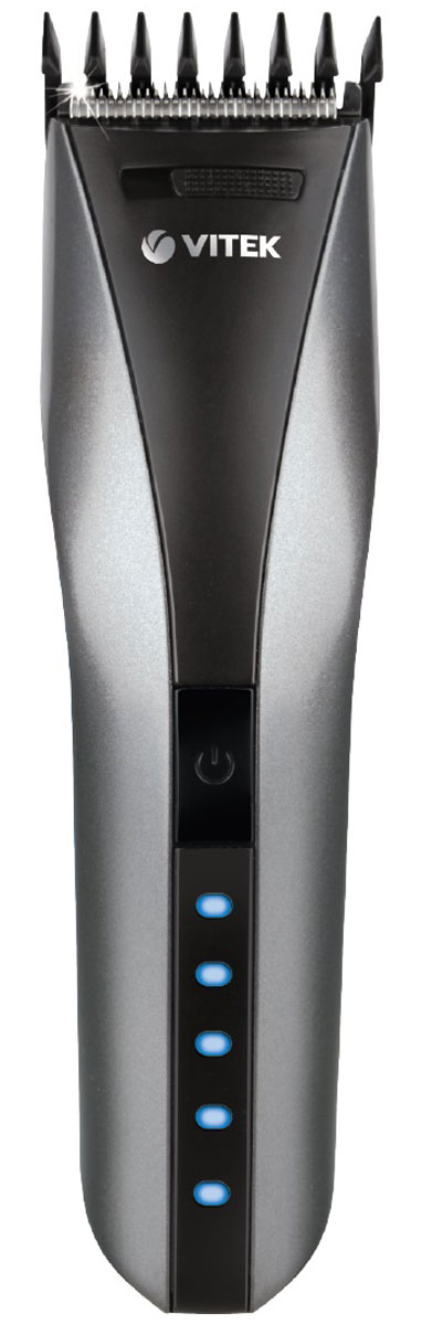 Vitek VT-2575(GR) машинка для стрижки волосVT-2575(GR) Vitek VT-2575(GR) машинка для стрижки волосVT-2575(GR)Машинка для стрижки волос Vitek VT-2575(GR) представлена в составе набора для стрижки и предназначена для стрижки и филировки волос. Работа изделия осуществляется как от сети, так и от аккумуляторной батареи NiMh, что делает работу парикмахера более комфортной и практичной. Батарея способна поддерживать автономную работу в течении 60 минут. Прибор оснащен LED индикацией. Светодиодные индикаторы отображают уровень зарядки/расхода встроенной аккумуляторной батареи: 10%, 20% , 40% , 60%, 80%, 100%. К машинке прилагается набор для ухода за ней, в который входит: универсальная насадка 3/6/9/12/15/18 мм, щетка для очистки, масло для смазки ножей и расческа.