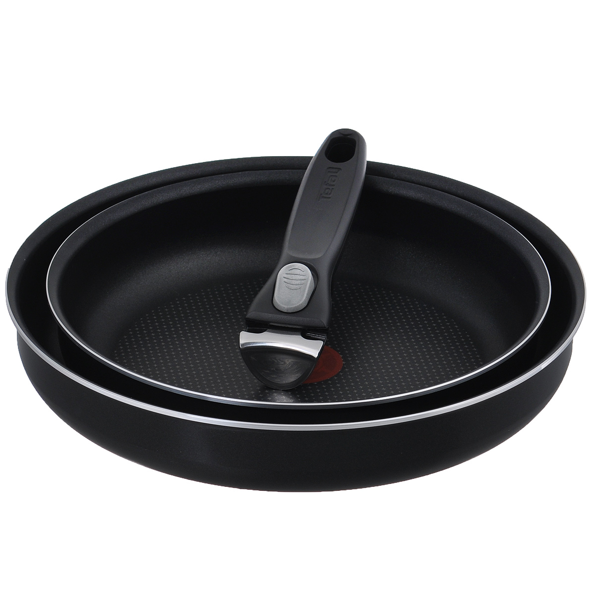 Набор сковородок Tefal Ingenio, с антипригарным покрытием, со съемной ручкой, цвет: черный, 3 предмета. 91000158919100015891 Набор сковородок Tefal Ingenio, с антипригарным покрытием, со съемной ручкой, цвет: черный, 3 предмета. 91000158919100015891Набор Tefal Ingenio состоит из двух сковородок и съемной ручки. Сковороды выполнены из алюминия с внутренним усовершенствованным антипригарным покрытием Resist + и внешним эмалевым покрытием. Уникальная посуда занимает минимум места и дарит вам максимум возможностей! Все дело в съемной ручке из бакелита со вставками из нержавеющей стали - с ней вы сможете готовить разнообразные блюда, используя небольшой набор посуды. Благодаря такой ручке посуда компактна и складывается по принципу матрешки. Основные преимущества: - Мгновенное распределение тепла, устойчивость к деформации, - Индикатор нагрева Thermo-Spot становится равномерно красным при достижении оптимальной температуры, - Компактность, - Уникальные лучики на дне для оптимального распределения тепла, - Запекание продуктов в духовке. Можно мыть в посудомоечной машине. Подходит для всех типов плит, кроме индукционных. Диаметр сковородок (по верхнему...