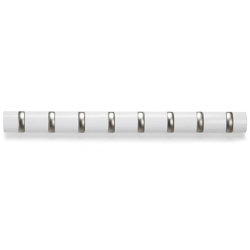 Вешалка настенная Umbra Mini Flip, цвет: белый, 8 крючков318863-660 Вешалка настенная Umbra Mini Flip, цвет: белый, 8 крючков318863-660Стильная и прочная вешалка Umbra Mini Flip интересной формы и оригинального дизайна изготовлена из дерева. Имеет 8 откидных крючков из никеля: когда они не используются, то складываются, превращая конструкцию в абсолютно гладкую поверхность. Вешалка Umbra Mini Flip идеально подходит для маленьких прихожих и ограниченных пространств. Каждый крючок выдерживает вес до 2,3 кг. Размер вешалки: 82 см х 6 см х 3 см.