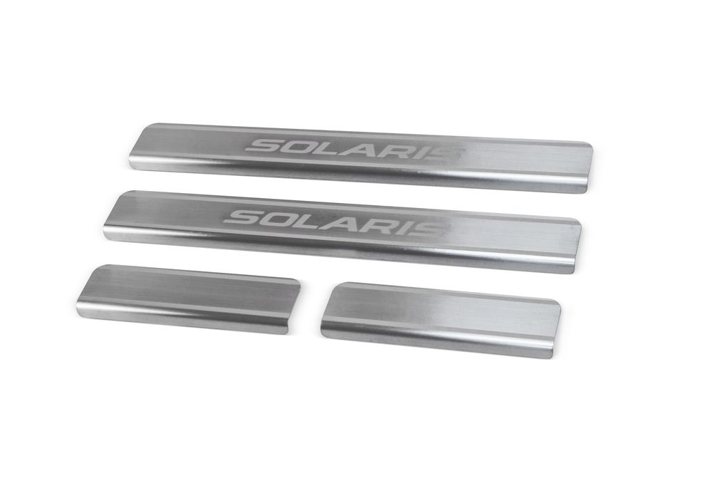 Накладки на пороги Rival для Hyundai Solaris 2011-, 4 штNP.2301.3 Накладки на пороги Rival для Hyundai Solaris 2011-, 4 штNP.2301.3Накладки на пороги RIVAL Накладки на пороги создают индивидуальный интерьер автомобиля и защищают лакокрасочное покрытие от механических повреждений - Использование высококачественной итальянской нержавеющей стали AISI 304. - Надежная фиксация на автомобиле с помощью “фирменного” скотча 3М. - Устойчивое к истиранию изображение на накладках нанесено методом абразивной полировки. - Идеально повторяют геометрию порогов автомобиля. Уважаемые клиенты! Обращаем ваше внимание, что накладки имеют форму и комплектацию, соответствующую модели данного автомобиля. Фото служит для визуального восприятия товара.