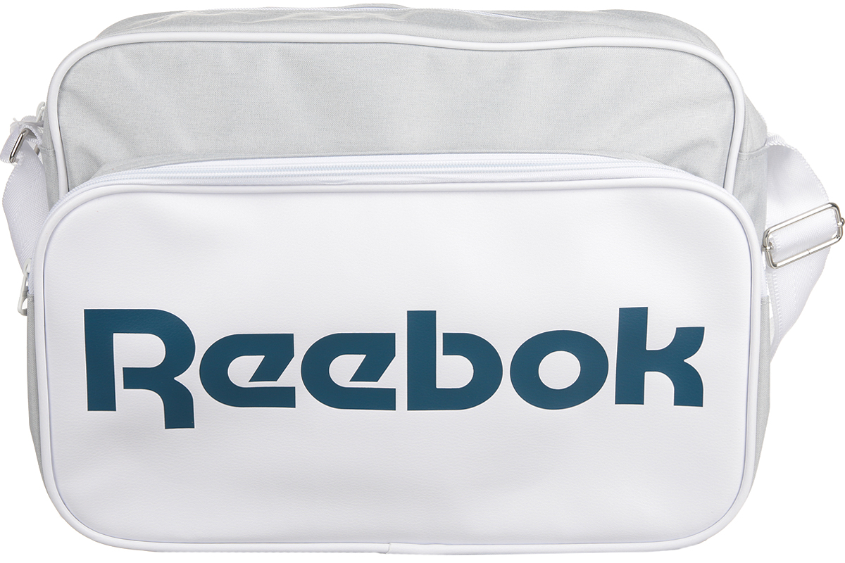 Сумка спортивная Reebok Cl Royal Shoulder, цвет: белый. AX9946AX9946 Сумка спортивная Reebok Cl Royal Shoulder, цвет: белый. AX9946AX9946Сумка Reebok из прочных материалов, классический дизайн и объемный логотип Reebok. Благодаря классическому дизайну она вместит в себя все необходимое. Двойная ручка для удобного ношения в руке. Тканый принт в виде флага и логотип Reebok эффектно дополнят твой образ.