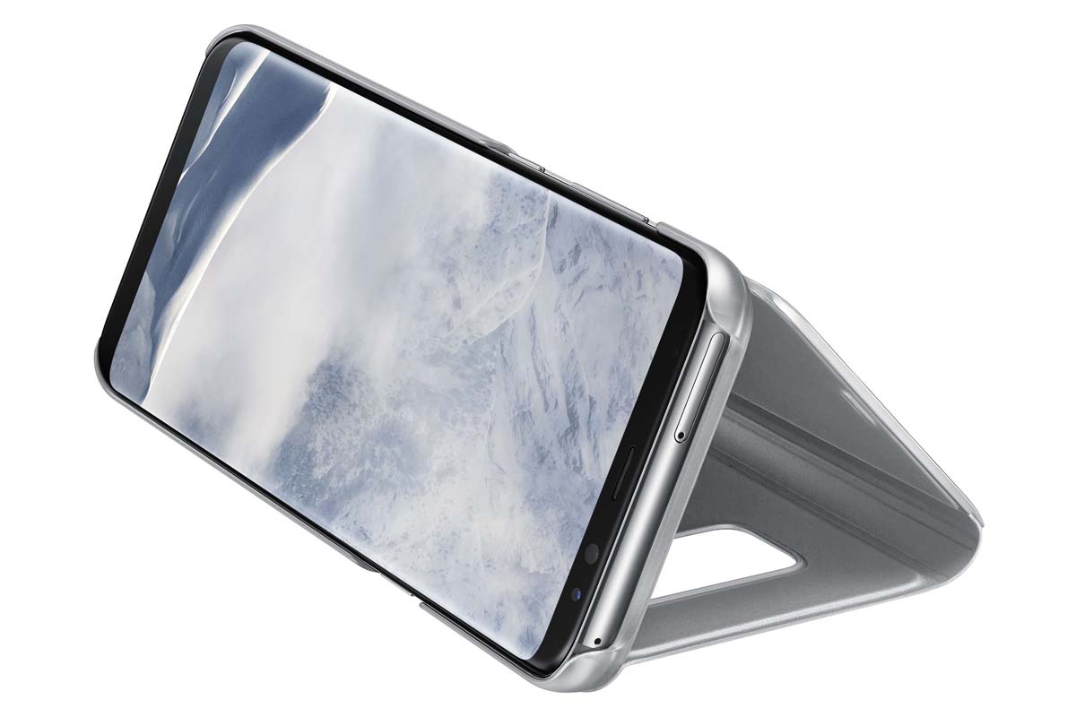 Samsung Clear View Standing чехол для Galaxy S8+, SilverEF-ZG955CSEGRU Samsung Clear View Standing чехол для Galaxy S8+, SilverEF-ZG955CSEGRUТонкий полупрозрачный чехол подчеркивает стиль и изящество смартфона. Аксессуар обеспечивает быстрый доступ к функциям — следите за информацией на экране, не открывая чехла. Сквозь прозрачную верхнюю крышку видны время, пропущенные вызовы, индикатор заряда. Флип-кейс отзывчиво реагирует на прикосновения — отвечайте на звонки одним легким движением. Чехол устойчив к появлению отпечатков пальцев — ваш смартфон всегда в аккуратном состоянии. Особое покрытие чехла защищает смартфон от повреждений, продлевая срок его службы.